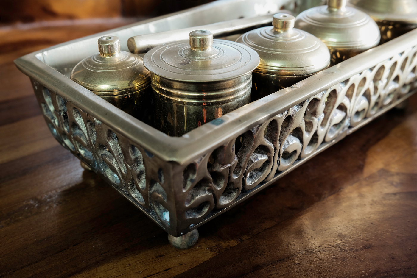 Malay heritage brassware, wedding equipment called Tepak Sireh over wooden background