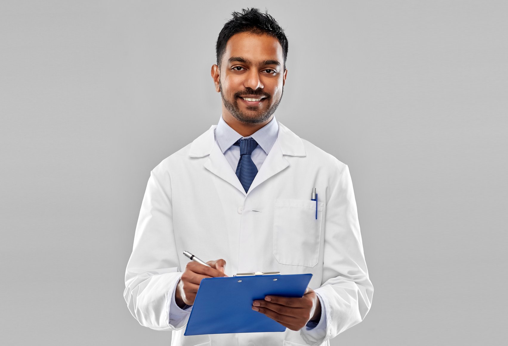 Smiling Indian Doctor or Scientist with Clipboard