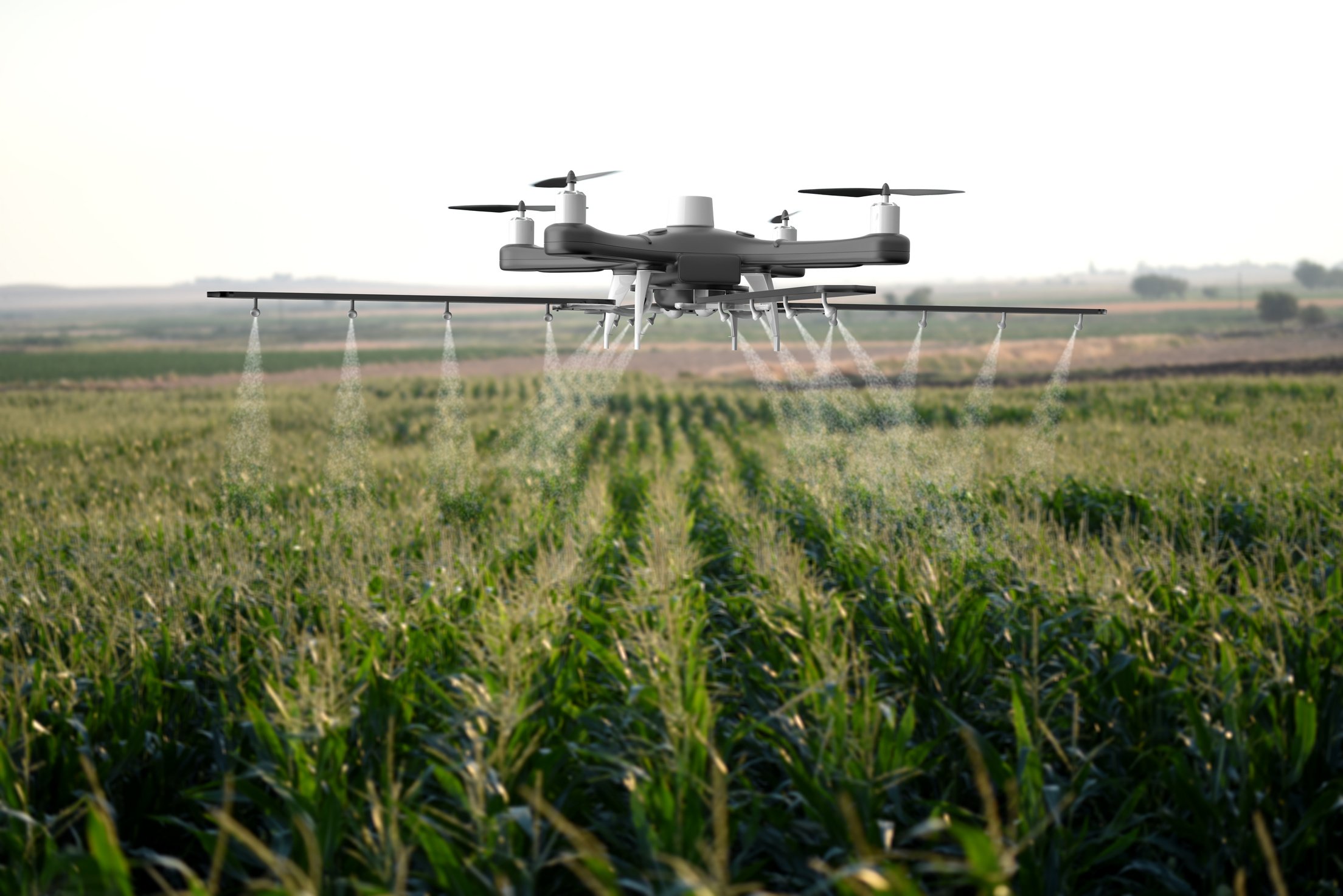 Drone spraying a field